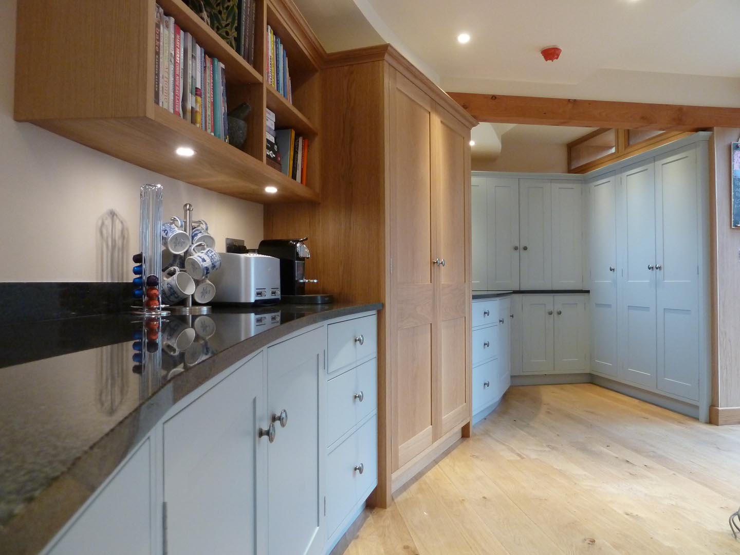 Modern Oak and painted kitchen with a curved/serpentine wall
