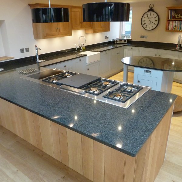 Modern Oak and painted kitchen with a curved/serpentine wall