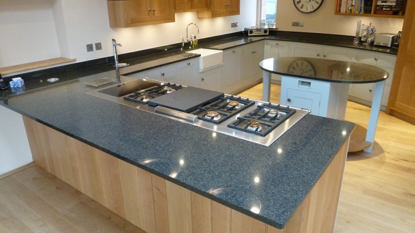 Modern Oak and painted kitchen with a curved/serpentine wall